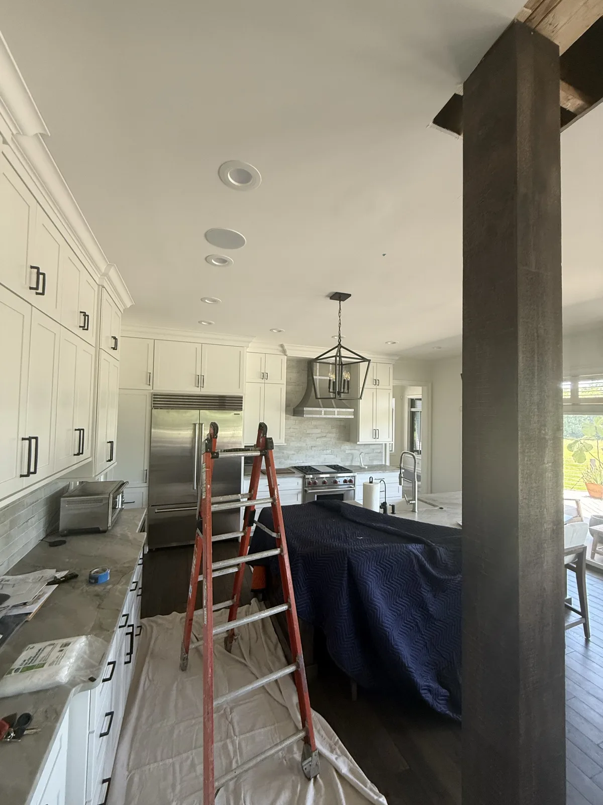 Kitchen remodel in progress with cabinets and stone counters